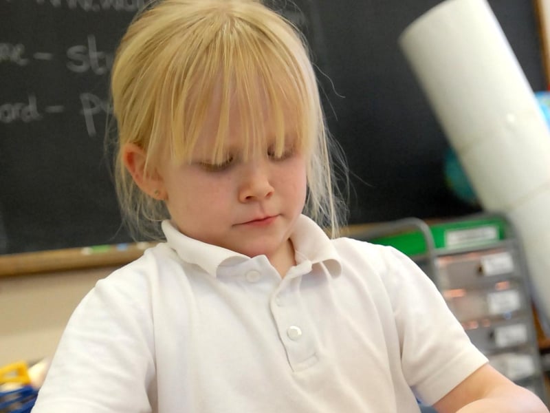 Eyes down for a spot of concentration in one of the lessons, but we want to know if you recognise the pupil pictured.