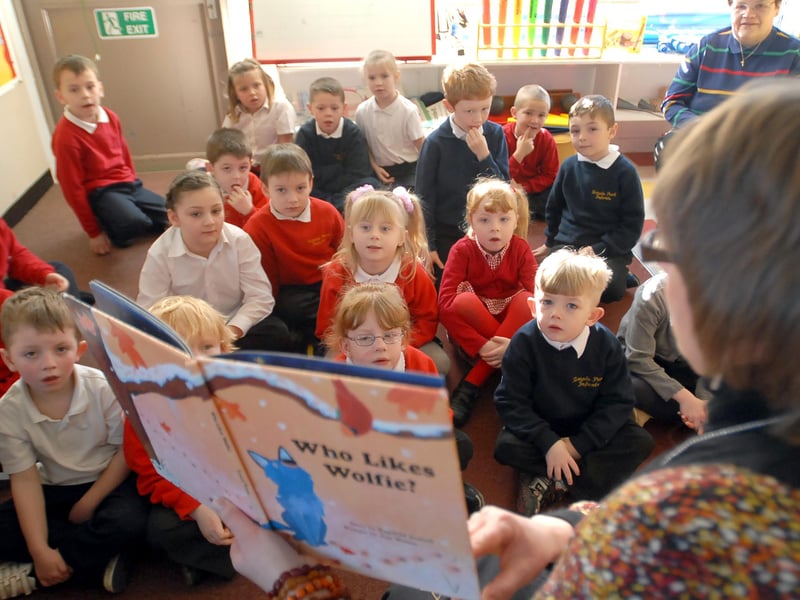 Look at the fascination on the faces of these youngsters as they enjoy a reading session at the school.