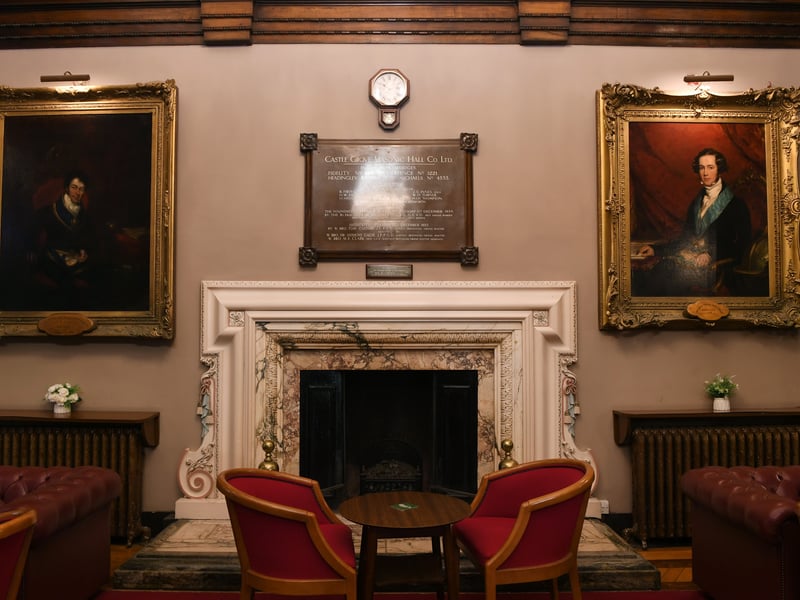 Portraits on the wall in the Castle Grove foyer
