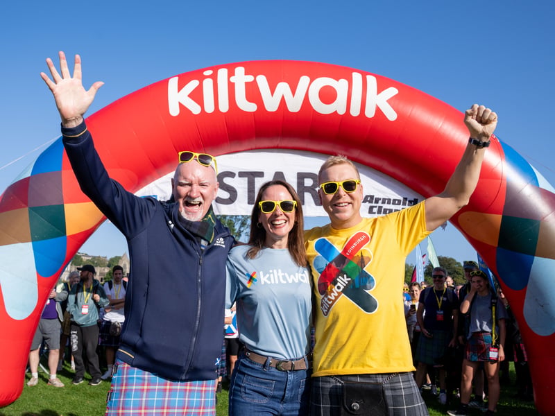Sir Chris Hoy and his wife Lady Sarra Hoy joined philanthropist Sir Tom Hunter to lead out 8,000 fundraisers at the Edinburgh Kiltwalk in the sunshine.