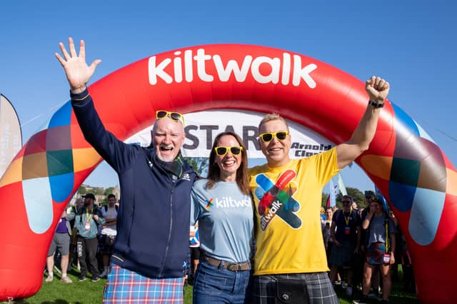 Sir Chris Hoy and his wife Lady Sarra Hoy joined philanthropist Sir Tom Hunter to lead out 8,000 fundraisers at the Edinburgh Kiltwalk in the sunshine.