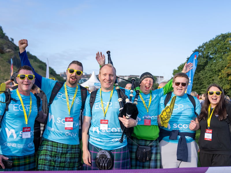 Kiltwalkers at the start line  of the Edinburgh Kiltwalk 2026 at Holyrood Park.