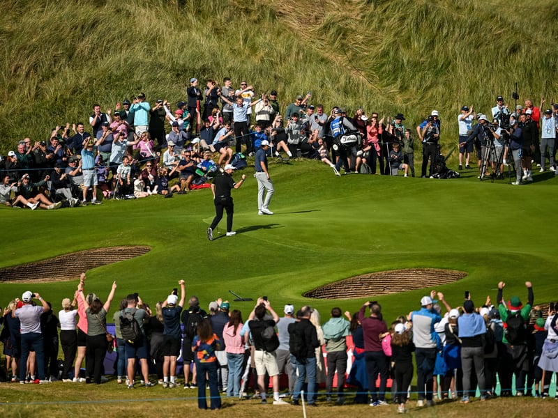Shane Lowry celebrates after putting on the seventh green. 