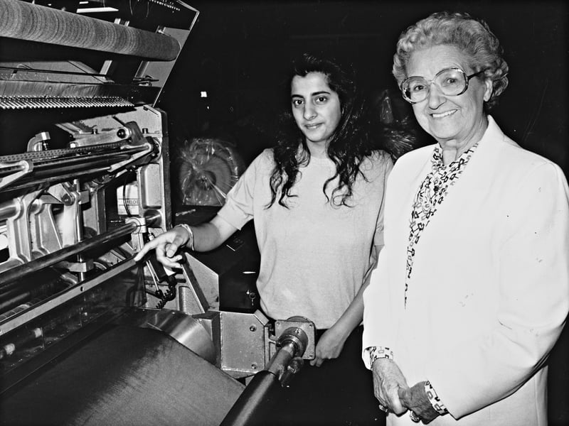 Sonia Sharma demonstrates industrial textile machinery during a VIP visit in September 1992. Following the tragic passing of their father, Sonia, her sister Anita, and brothers Anil and Ajay rallied together to keep the family firm, Sharma Saki, running on the A1 Industrial Estate in Lewisham Road, Smethwick. Sandwell Council leader Mrs Evelyn Matthews visited the factory to praise the young siblings, who successfully balanced running a thriving textile business alongside their higher education studies and professional training. Do you remember visiting or working on the industrial estates around Smethwick in the early 1990s?