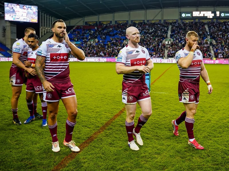 Wigan players leave the field after celebrating their League Leaders' Shield triumph