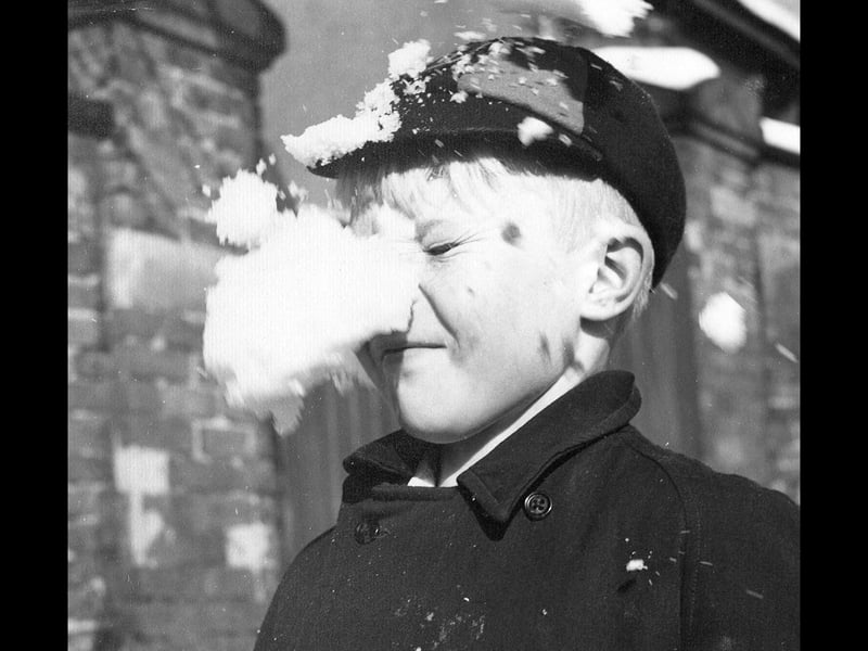 Talk about perfect split-second timing! Young Keith Keeling, a pupil from Kate's Hill Primary School in Dudley, gets caught squarely in the crossfire during a chilly walk home in January 1956. The brilliant action snapshot captures the exact moment a direct-hit snowball splatters across the schoolboy's face and flat cap. A timeless image of winter childhood innocence, playful schoolyard rivalries, and the simple, snowy fun that generations of Black Country kids enjoyed on their way home after the final bell.