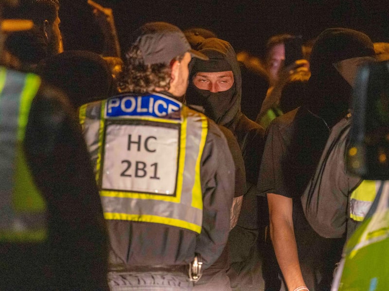 Police and protesters in Gosport after police closed off the access road to Haslar Marina, after British rescue boats have been sent to collect the passengers of a migrant dinghy which has spent around 30 hours at sea. Photo: Trevor Adams/PA Wire