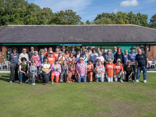 Members in period costumes for the Wharfemeadows Bowling Club charity game to raise money for the Rob Burrow Centre for MND, with a 1970s theme.