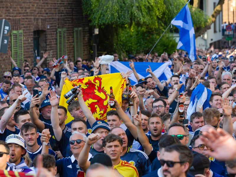 Scotland fans on a march to the game against Switzerland in Koln at Euro 2024.