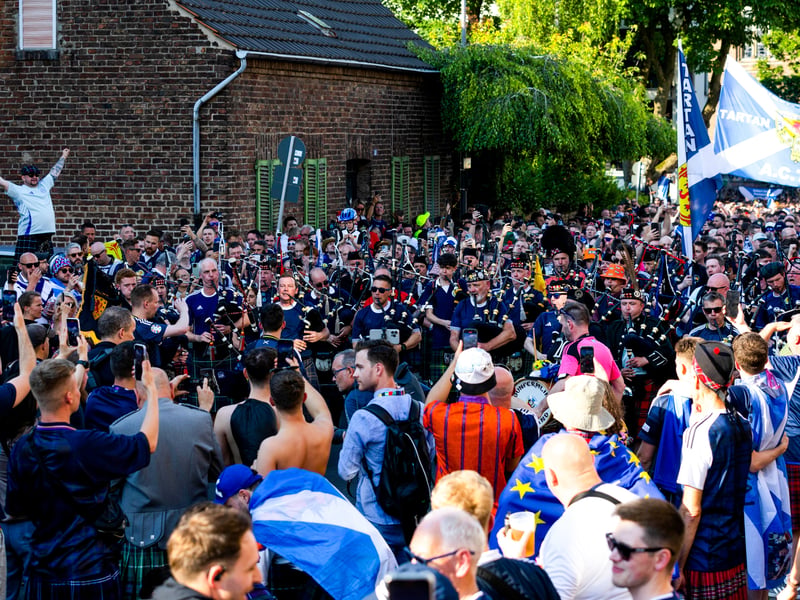 Scotland fans line the streets on the way to the game in Koln.