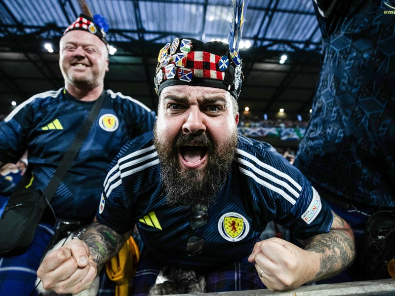 A Scotland fan celebrates Scott McTominay's goal against Switzerland at the Koln Stadium.
