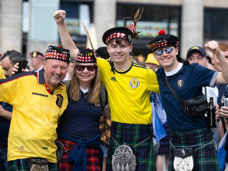 Scotland fans get their retro kits out in Koln.