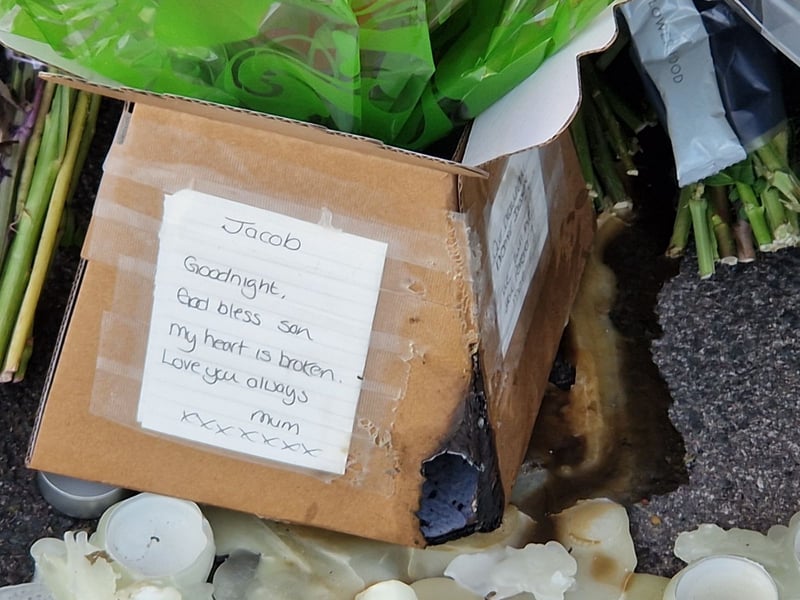 A handwritten note reads: "Jacob, God bless son. My heart is broken. Love you always, Mum."