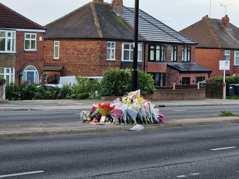 Floral tributes, photos and cards have been heaped at the scene of a fatal crash on East Bawtry Road, Rotherham, where friends held a memorial service to Jacob Skidmore and Jacob Patching on September 27, 2026.