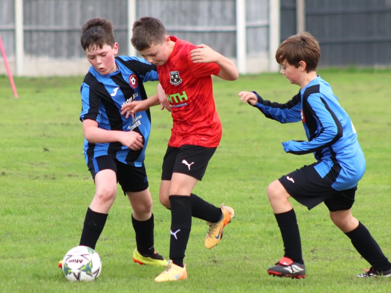 Action from Freckleton Under-11s (in red) v Poulton FC Blacks