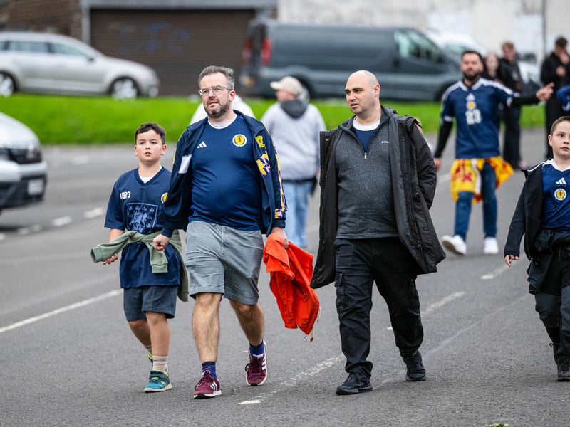 A family of Scotland fans arrive at Hampden for the game.