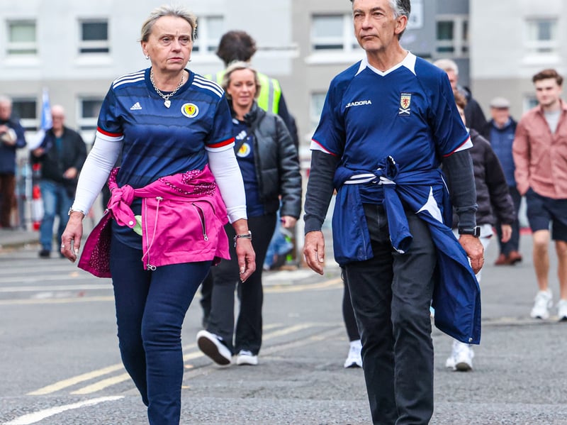 Two Scotland fans make their way to the match in Mount Florida.
