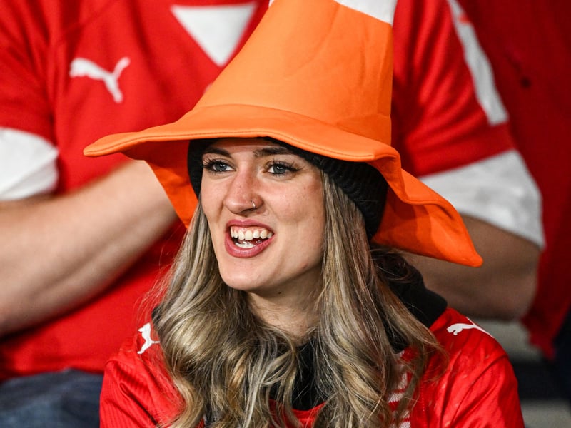 A Switzerland fan wearing a cone hat in the Hampden stands.