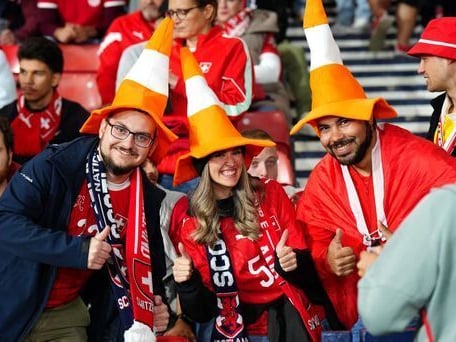 Switzerland fans get in the mood for the game against Scotland in Glasgow.