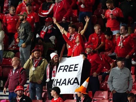 Switzerland fans hold up a sign for missing captain Granit Xhaka at Hampden.