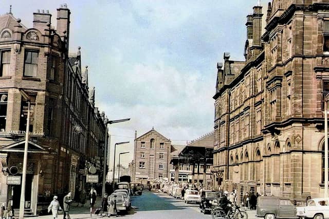 A busy Market Street in Preston in 1960, with traffic, shoppers and familiar city-centre buildings