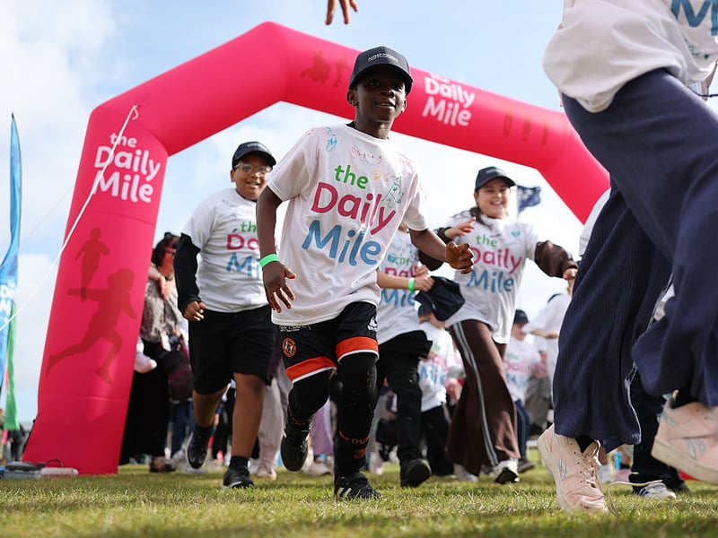 Children take part in the Daily Mile race prior to the Alfred Dunhill Links Championship at St Andrews Old Course.