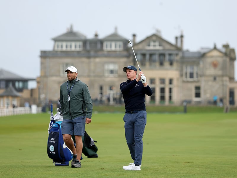 Luke Donald plays a shot during the practice round with the St Andrews clubhouse in the background.
