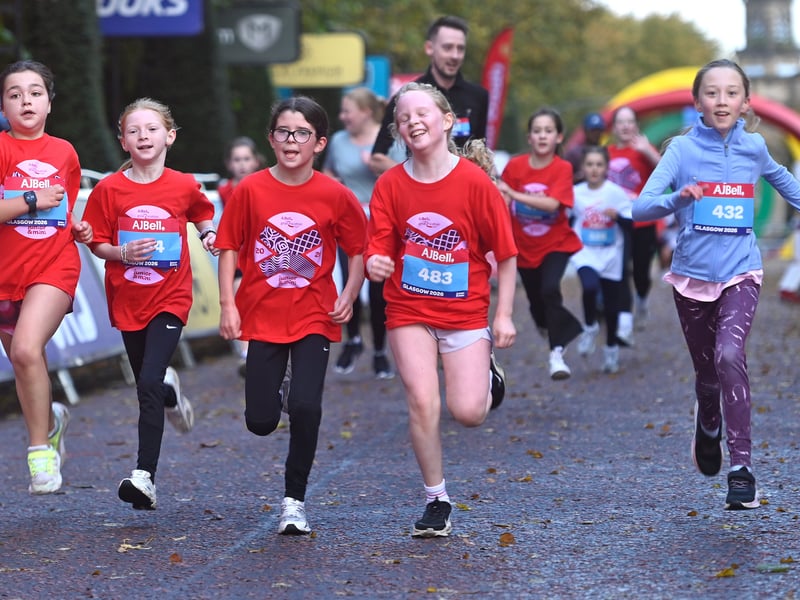Don't forget the cameras! All smiles as these girls took part in the Mini Run.

