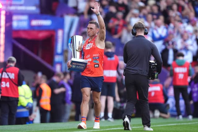 Sir Kevin Sinfield brings out the trophy ahead of the Betfred Super League Grand Final at Old Trafford, Manchester.