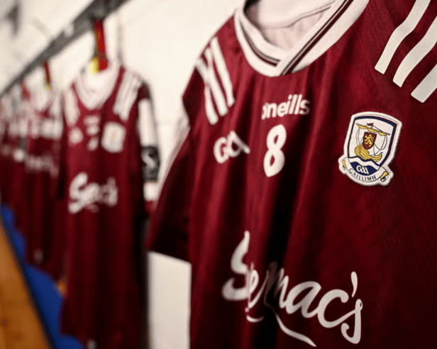 Galway GAA jerseys hanging on dressing room wall