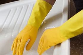 Yellow marigold gloves stock image