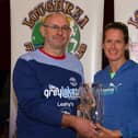 Fergal Leahy presented Yvonne Feehily with her prize after she won the women's section of the Loughrea 10K.