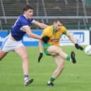 Corofin's Liam Silke in action against and Dara Walsh of Killannin in the group stages of this year's championship