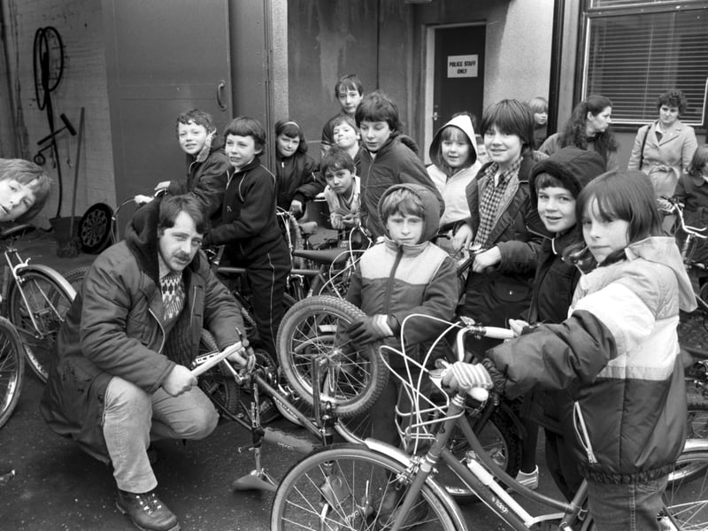 Constable Graeme Harvey stamps the postcode onto local children's bikes outside South Queensferry police station in March 1984.