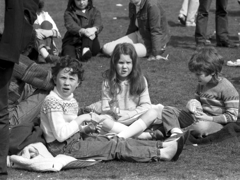 Three little girls at Sighthill park for the rock concert, part of Edinburgh Spring Fling Festival in May 1985.