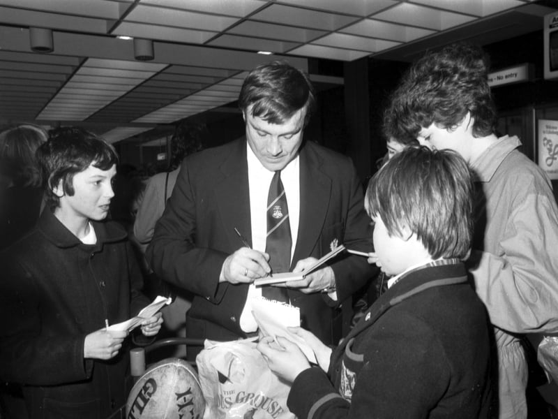 Scotland rugby captain Jim Aitken signs autographs for fans at Edinburgh airport in March 1984 after Scotland beat Ireland in the Five Nations match at Lansdowne Road in Dublin to win the Triple Crown, before going on to win the Grand Slam.