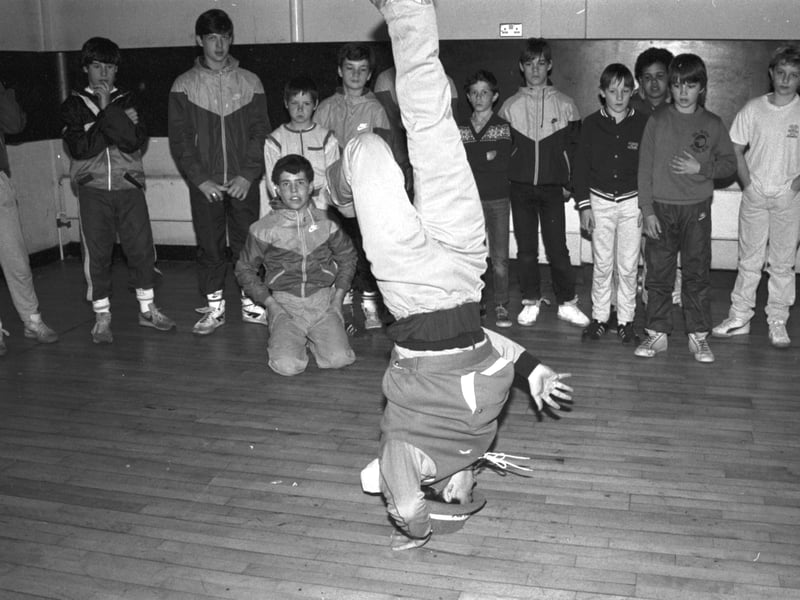 A boy from Soul Sonic Rockers demonstrates break dancing at the Triangle arts centre in Edinburgh's West Pilton in April 1985.