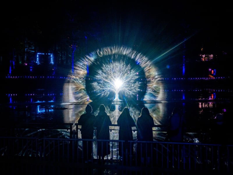 People watch the projection show on Loch Dunmore at The Enchanted Forest, Scotland's award-winning sound and light spectacular which opened its 2026 show Stop The Clock: The 25th Hour, in the surroundings of Faskally Wood, Pitlochry. 