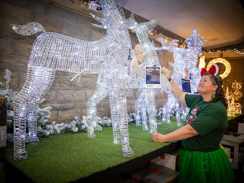 Shannon Carter arranging Christmas decorations.