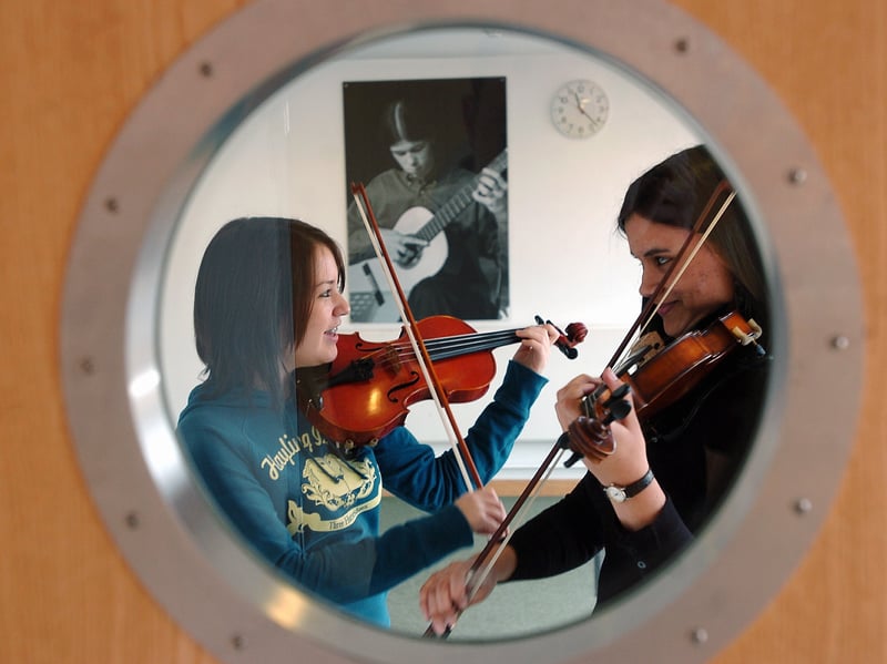 Violinists Louise Gibbons (17), (right) and Jenny Bartlett (16) in the music department  at South Downs College in 2005.
Picture: Matt Scott-Joynt (051048-89)
