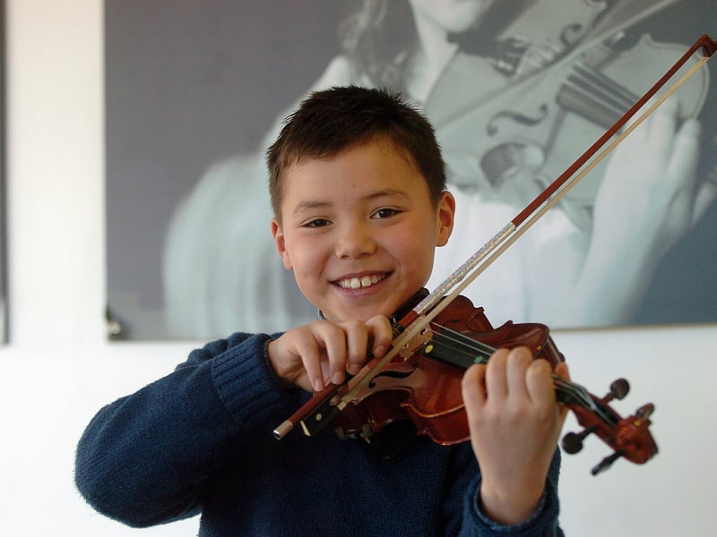 Young Portsmouth Grammar School violinist Brandon Choi (8) from Southsea, who was first place and winner with honours in the Pre-Grade Standard competition, and won the Warfield Cup No2 for his 20th Century Piece at Portsmouth Music Festival in South Downs College, Purbrook in March 2006.
Picture: Michael Scadden (060982-0045)