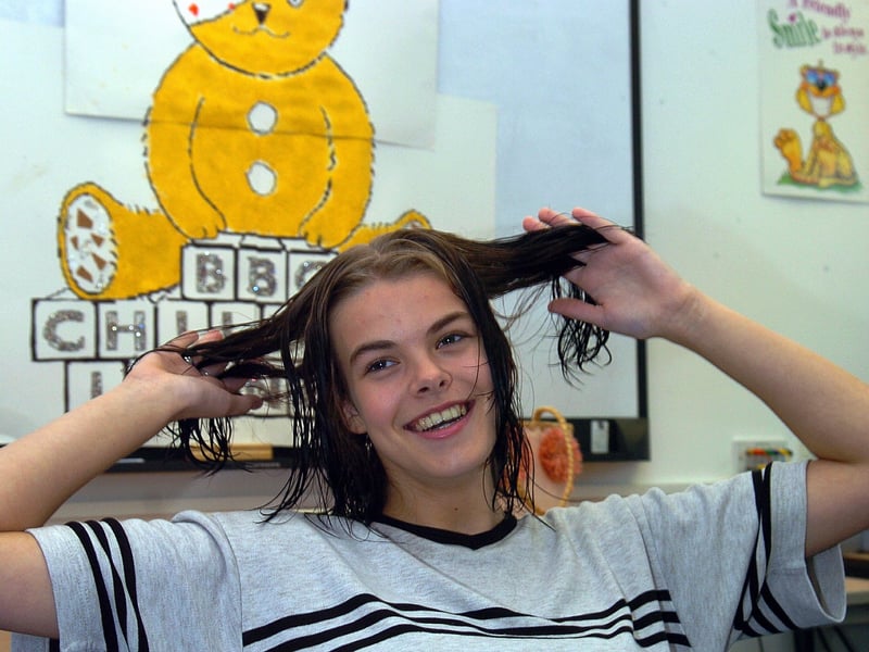 Having her hair cut for BBC Children in Need, student Rhi Dewey (20) of South Downs College, Crookhorn, Waterlooville, whose mother Carol Dewey (57) a trained hairdresser, shortened her locks for charity in November 2006.
Picture: Michael Scadden (064855-0031)