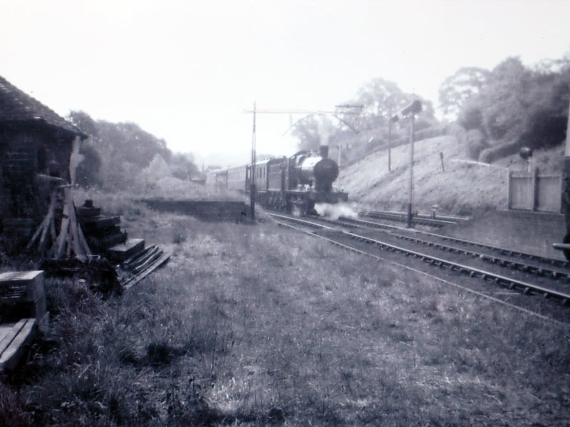 "Worcester 'Collett' 0-6-0 No. 2241 in the sidings at Coalport having just arrived with the special train carrying the Duchess of Kent on board, Monday, May 27, 1957. The next day, after an overnight stop, the train took the Duchess to Bridgnorth for her official visit to the town. On the left is the former weighbridge office which in 1941/42 was reinforced with concrete and used as a pill box to guard the river crossing and ammunition trains." It's another picture originally from Mrs Joan Higginson.