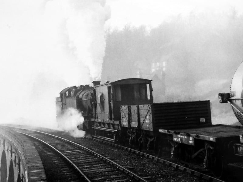 "GWR 2-8-2 tank No. 7221 propelling a train of oil tanks over Coalbrookdale viaduct circa 1955. Wellington driver Joe Burdon was in charge of the train which had originated at Farley oil depot on the Much Wenlock branch - the heaviest tank engine to be used on the Severn Valley line."