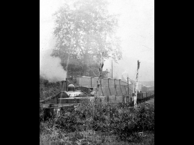 A locomotive at Coalport in the 1920s, near the high wall and not far from The Brewery pub. We are looking down towards the terminus of the line.