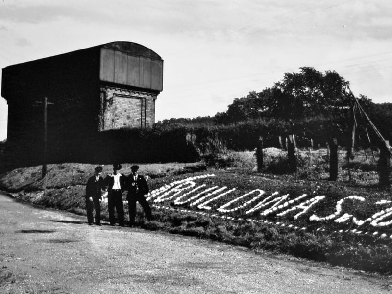 Keith said during a railways strike in 1955 not all workers were affected, and those at Buildwas Junction had nothing to do, so they got a lot of stones and laid this out in the stationmaster's garden and whitewashed them. The message written in stones says: "Buildwas Junction." On the back of the print is written: "Buildwas, 1955, l-r Phil Bagnall (leading porter), Maurice Dicken, Ern Dicken. Stones put in during 1955 strike as National Union of Railwaymen members did not strike. Not much for staff to occupy themselves." The picture came from Keith but originally came from a negative from Mike Picken.