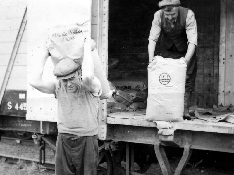 Unloading salt at Coalport Station. Salt was for spreading on platforms in snow and frosts, and was stored in the old weighbridge office, nicknamed the salt house. On the left is Alf Bowdler. Keith's photo came originally from Mrs Joan Higginson.