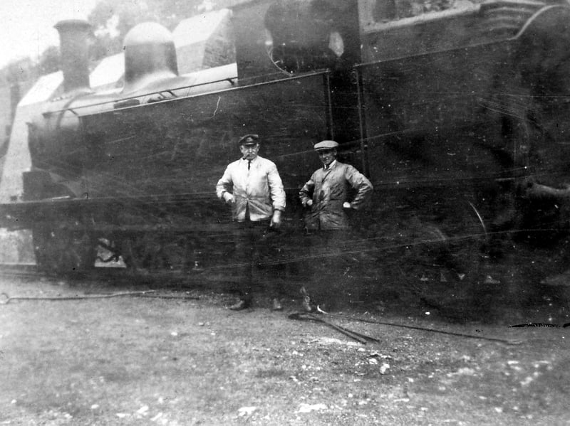 George Hadley, Don Canham (fireman), and engine 7774 in early LMS livery, at Coalport in about 1925. George Hadley, on the left, was nicknamed Plum. Just off the picture far left were the supports for the high wall at Coalport. They were called batters.