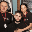 Adam (centre) pictured with his parents Greg and Ola at the 'Man of Steel festival' in his honour at the Róisín Dubh in August 2025