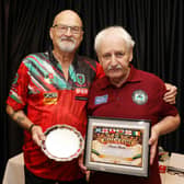 EBA Learning Disabilities Chairperson, Stephen Partridge presents Trevor Harte, organiser with the First Hall of Fame, legendary status certificate during the Opening Ceremony of the Northern Ireland Disability Pool Festival held at the Lodge Hotel. WK42-26-03TMSP
